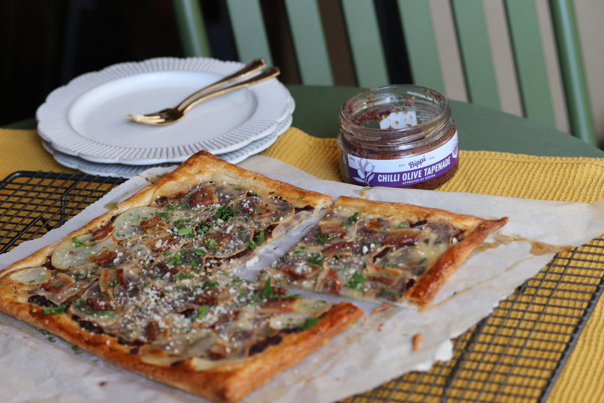 Puff pastry tart with potato, lardo and Bippi Chilli Olive Tapenade